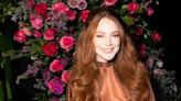 Lindsay Lohan shows off her growing baby bump on magazine cover