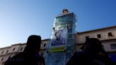 Activists unfurl banner at Madrid museum to demand Gaza ceasefire