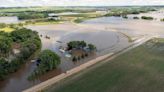 Rail bridge collapses during Midwest flooding as a heat wave persists across much of the US