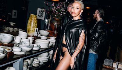Doja Cat Looks Like a Hot Garment Bag in This Pleather Cape and Thong