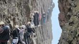 Moment terrified tourists are left dangling on 3,700ft mountain for an hour