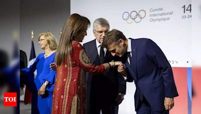 Nita Ambani stuns in red suit at 2024 Paris Olympics opening ceremony | - Times of India