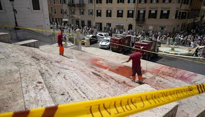 Red paint splashed down Rome’s Spanish Steps in femicide protest