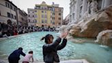 What happens to the coins tossed into Rome's Trevi Fountain?