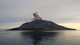 Airport near volcano reopens as Indonesia lowers eruption alert level