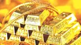 Gold prices decline from all-time peak on profit taking, firmer dollar