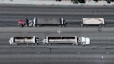 Large trucks carrying dirt cause traffic congestion along Las Vegas road