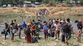 About 1,300 people from Myanmar flee into Thailand after clashes broke out in a key border town