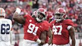 Alabama football DL Jaheim Oatis in a walking boot during warm-ups for USF game