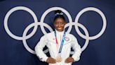 ‘No, I’m good, I’m 25’: Simone Biles offered colouring book on flight home from Washington