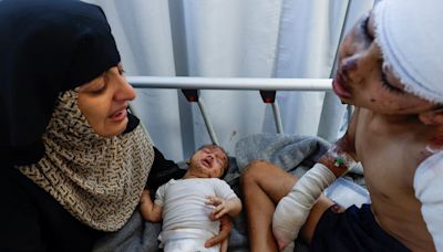 Young Gaza boy wounded and loses mother in Israeli airstrike