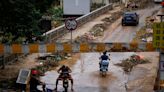 South China small businesses start to count cost of record rains