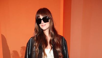 Dakota Johnson Wears transparent Black Bodysuit and Black Leather Jacket