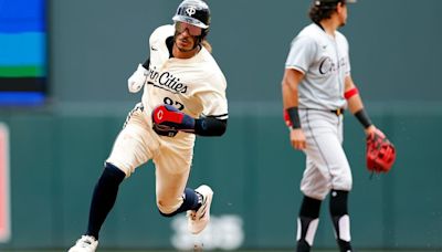 ...the Minnesota Twins advances to home plate to score a run on an RBI double by teammate Willi Castro against the Chicago White Sox in the second inning at Target Field on...