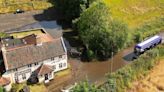 Aerial photos show impact of flooding at village pub