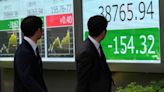 Stock market today: Asian shares retreat after Wall St edges back from records