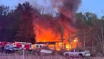 Flames roar through former Campbell car lot and mechanic shop