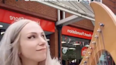 Extraordinary moment woman playing harp on high street is berated by passer-by who threatens to report her