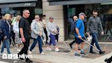 Eyecan hosts walk in St Helier with white cane users