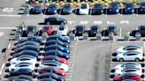 Why are hundreds of Teslas parked outside a dying shopping mall? A local news station solved the mystery.