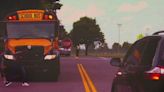 Stopped school bus. Oncoming emergency vehicle. What should I do?