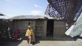 Indian mother delivers baby on boat as her river island is inundated by floodwaters