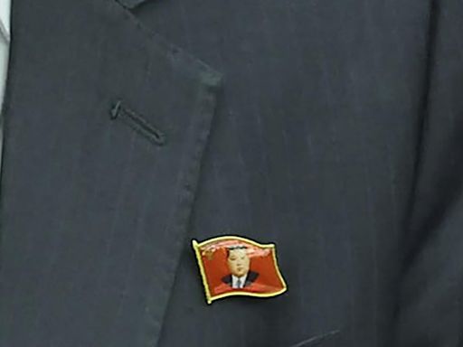 In a first, North Koreans seen wearing Kim Jong-un pins