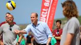 Prince William joins in volleyball game with children on Cornwall beach