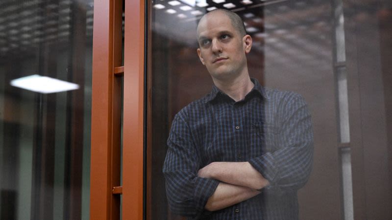 Evan Gershkovich appears in glass cage as espionage trial begins in Russia