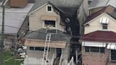 2 firefighters injured battling Bronx house fire, 1 in serious condition. Video from Chopper 2 shows damage
