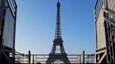 Paris Olympics organizers unveil a display of the five Olympic rings mounted on the Eiffel Tower