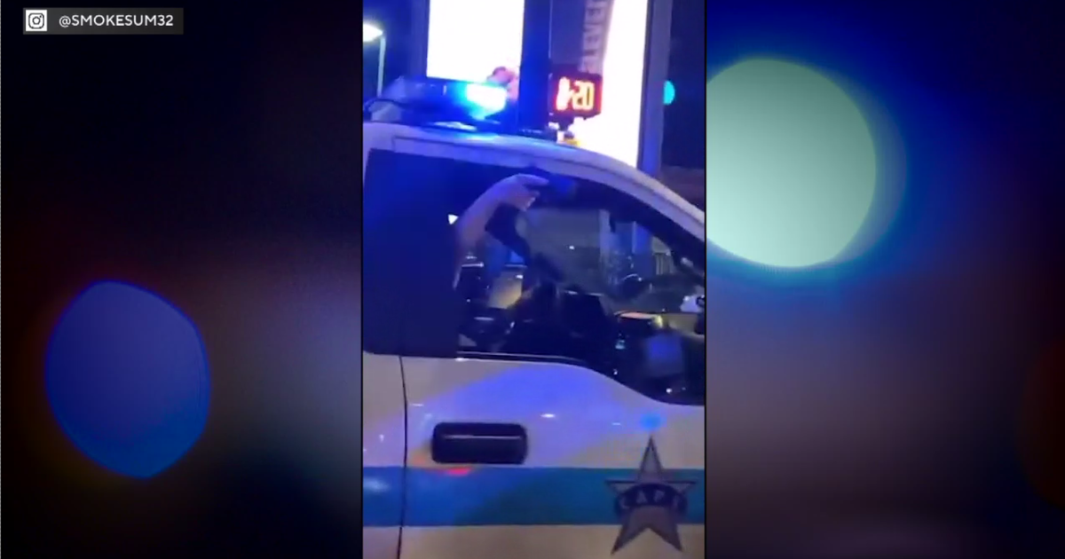 Video appears to show Chicago Police officer pointing gun during street takeover