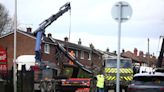 Watch: Crane smashes into roof of terraced house in Greater Manchester
