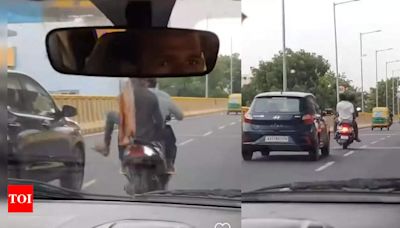 Watch: Bengaluru youth kick moving Grand i10 from scooters, arrested - Times of India