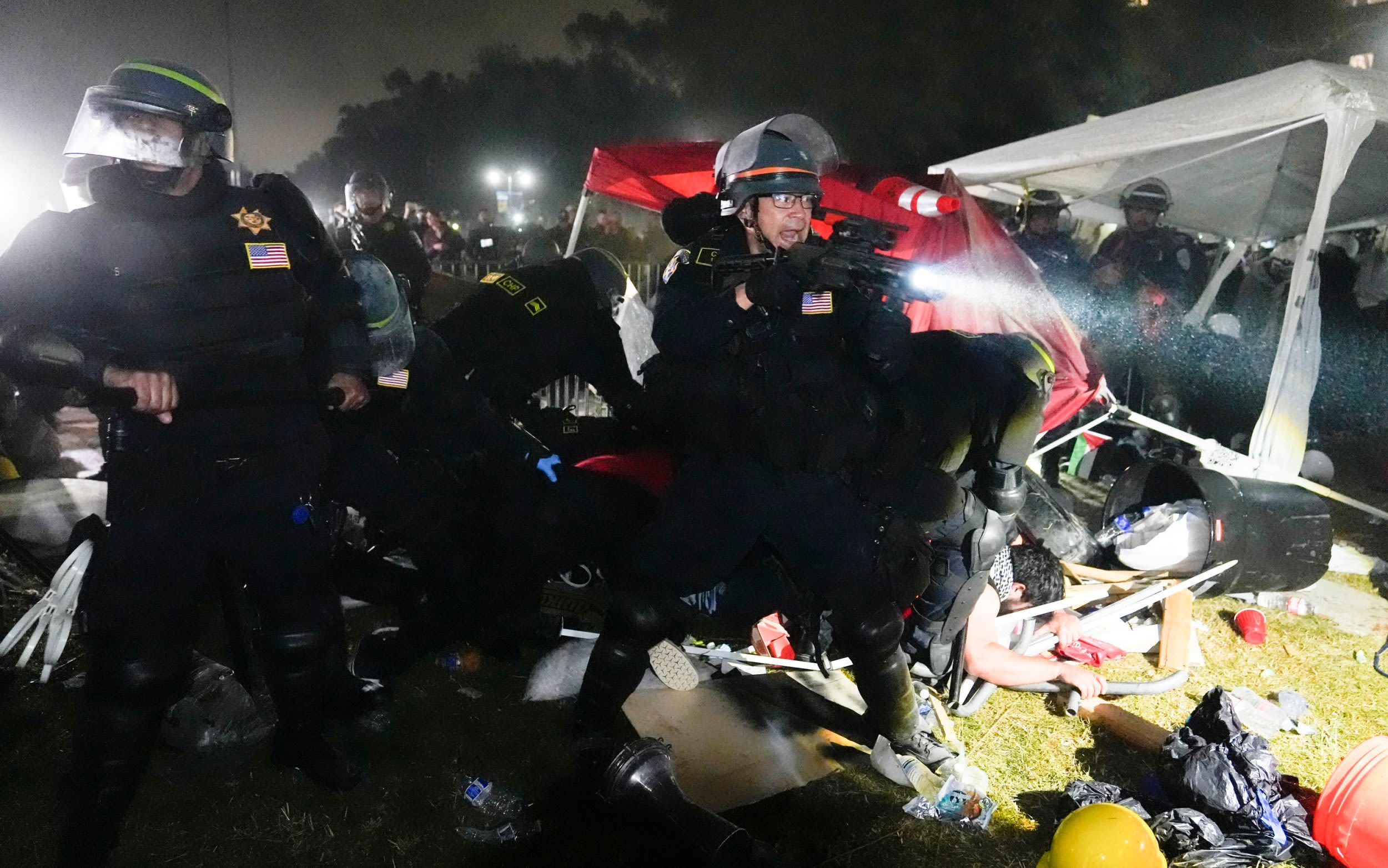 ‘Red brigade’ makes last stand at UCLA as police shut down campus protests across US