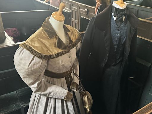 Gentleman Jack costumes displayed at wedding venue