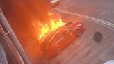 Picture shows vehicle engulfed in flames before spreading to cars