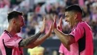 Luis Suarez celebrates with Lionel Messi after scoring his third goal against the New York Red Bulls in Saturday's 6-2 win.