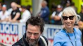 Keanu Reeves, girlfriend Alexandra Grant hop on motorbike at Grand Prix in Germany