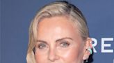 Charlize Theron Displays Her Toned Legs In A Tennis Skirt While Hosting The 20th Annual Desert Smash As Fans React: ‘She...