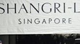 Police officers stand watch outside Singapore's Shangri-La Hotel on Friday, site of a yearly defence chiefs meeting increasingly seen as a barometer of US-China relations