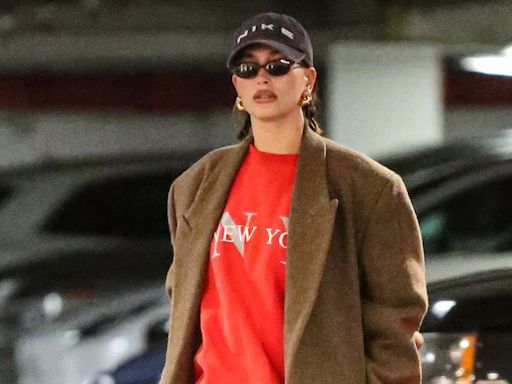 Hailey Bieber Bares Her Baby Bump in a Red Rugby Sweater