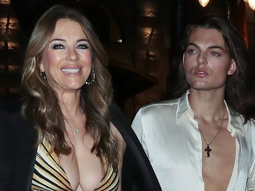 Liz Hurley, 59, shows off her ample cleavage alongside son Damian, 22