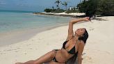 Kim Kardashian Poses in Black String Bikini During Sun-Soaked Beach Vacation: 'Paradise'