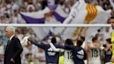 Winning coach: Real Madrid boss Carlo Ancelotti leaves the pitch as players celebrate their victory