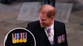 Prince Harry walked into King Charles' coronation service alone, wearing a morning suit with a nod to his military service