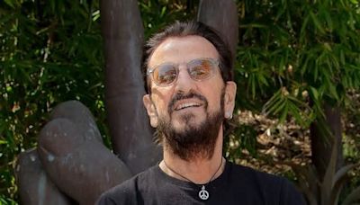 Ringo Starr reunites with John Lennon's long-lost acoustic guitar ahead of music auction where it is expected to sell for $800K