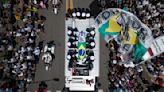 Pelé buried at cemetery in Brazilian city he made famous