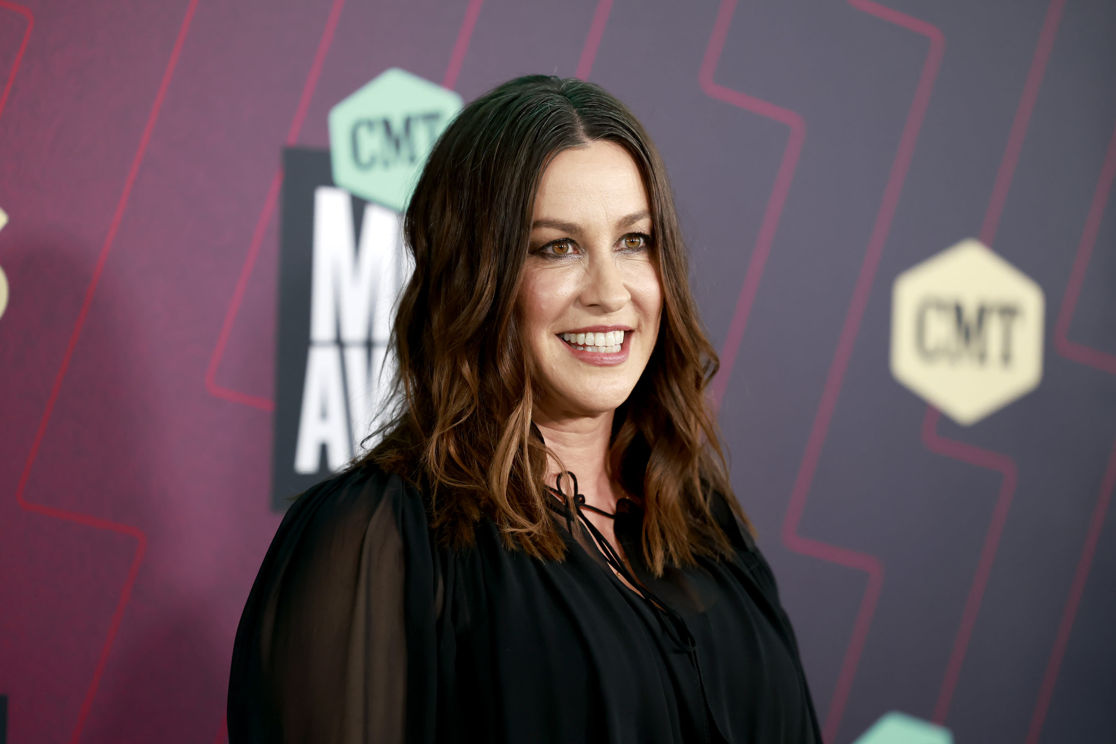 Alanis Morissette says she felt like she was 'slowly dying' amid postpartum depression: 'It's like your whole self disappears'