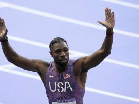 Noah Lyles has a gold medal around his neck and his eyes set on the stars